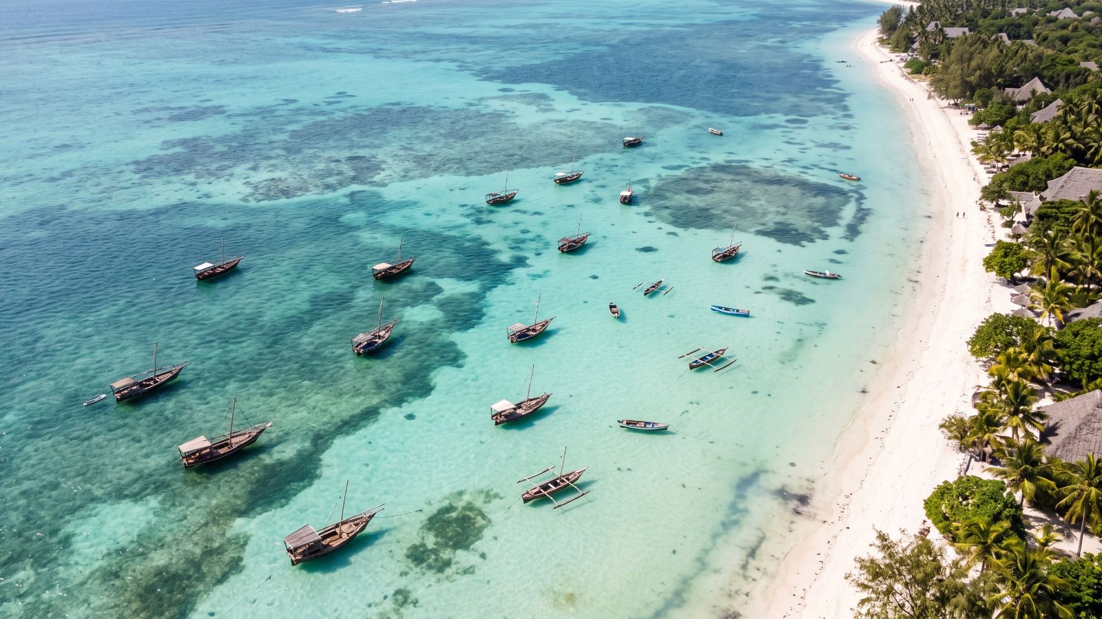 Čamci u tirkiznom plićaku uz obalu Zanzibara, pogled iz vazduha (AI prikaz)